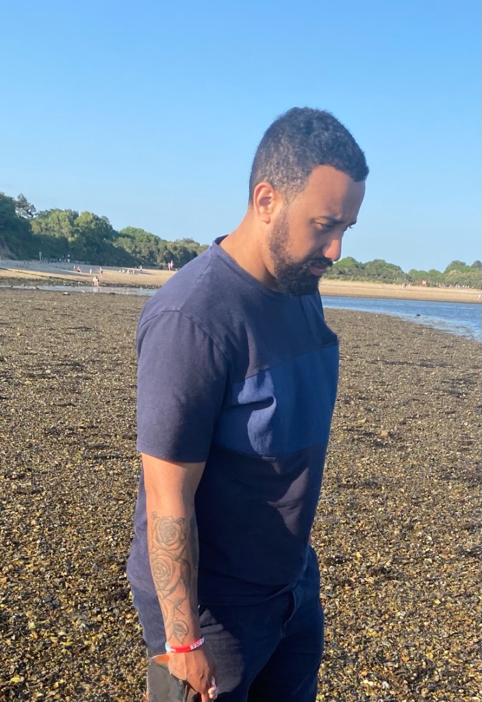 Tommo training on a stony beach